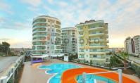 AL-1881, 1. katta, kapalı ve açık yüzme havuzları, sauna ve spor salonu bulunan, denize 250 m uzaklıkta, mobilyalı 1+1 daire (54 m²) – Avsallar