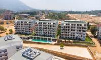 AL-2008, Gün Batımı, Deniz ve Dağ Manzaralı – İki Banyolu, 90 m²’lik Mobilyalı 2+1 Daire; Squash Sahası, Sauna ve Sinema Salonu, Oba