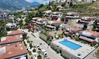 AL-2131, Özel Bahçe ve Deniz Manzaralı – Havuz, Sauna ve Spor Salonu Bulunan, Mobilyalı 100 m²’lik 2+1 Zemin Kat Daire, Kargıcak