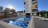 AL-2166, Plaja sadece 150 m uzaklıkta – Yerden ısıtmalı, havuzlu, saunalı ve spor salonlu, 60 m²’lik mobilyalı 1+1 daire, Kargıcak