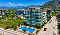 AL-2169, Geniş bir balkondan deniz, havuz ve dağ manzarası – Sauna ve spor salonu bulunan, mobilyalı 72 m²’lik 1+1 daire, Kestel