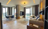 AL-2215, Kargıçak'ta, iki balkonlu, 105 m²'lik, mobilyalı, deniz kenarındaki 2+1 daire; havuzlar, hamam ve sinema