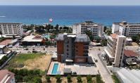 AL-2427, Kargıçak’ta, havuz, sauna ve spor salonu bulunan 2024 yapımı bir sitede, denize 100 m uzaklıkta, yepyeni 50 m²’lik 1+1 daire